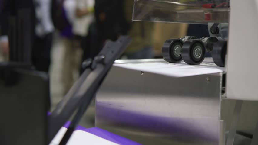 Mail-in and absentee ballots passing through a vote sorting machine in Philadelphia, PA after the 2020 Presidential Election. Close Up.