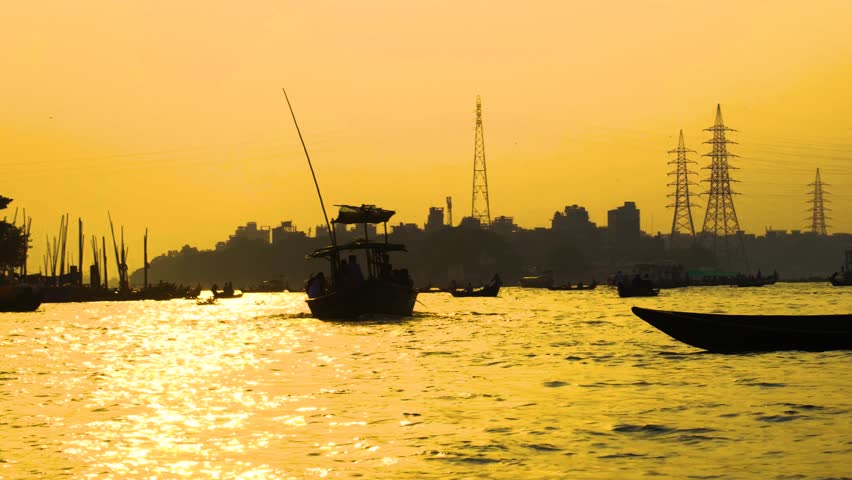 Busy Buriganga River With Passenger Boat And Fisherman During Sunset In Dhaka, Bangladesh, Asia. Static Shot
