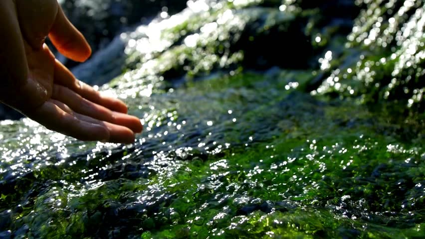 close up hand held shot. Woman pouring flowing fresh water. global water crisis, Tourism and hiking. SLOW MOTION resources, Tiny waterfall river HD 4K