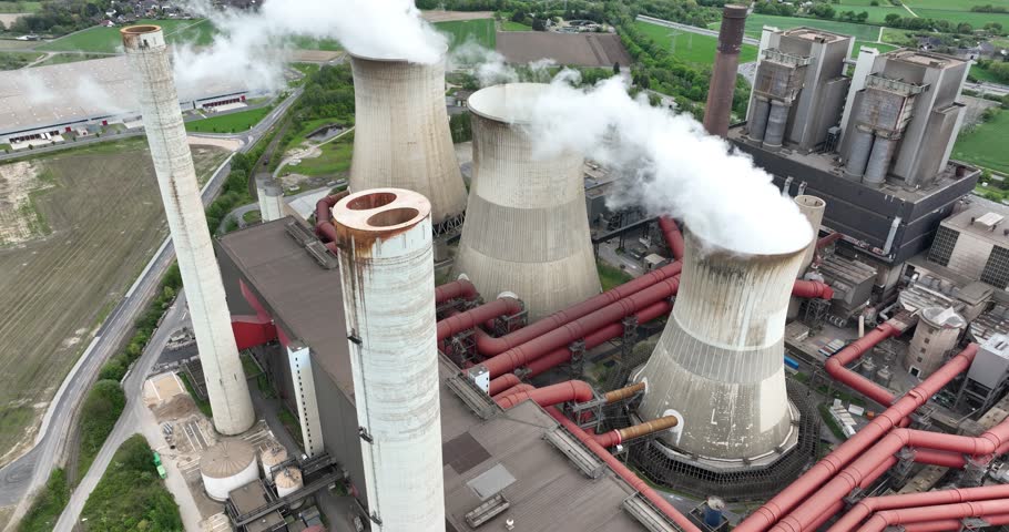 Weisweiler power station, This power plant is mainly fueled by lignite extracted from the Inden open pit mine. Water vapor clouds, detailed view of cooling towers. Aerial drone view.