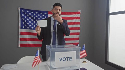 Young, happy hispanic man as american electoral college candidate, expressing his idea, pointing with one finger and soliciting votes for government with a question numbered one – Video có sẵn