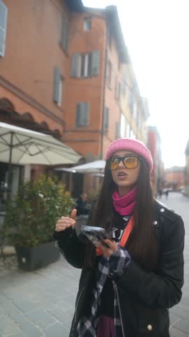 A vibrant young tourist explores a new Italian city using her phone