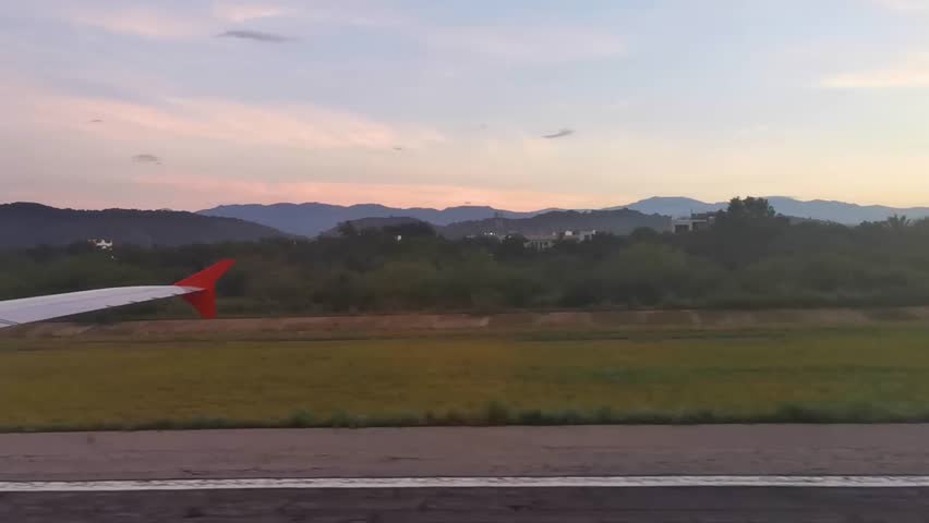 Plane landing on the coast airport in Puerto Escondido with view from the window Puerto Escondido zicatela Oaxaca Mexico.