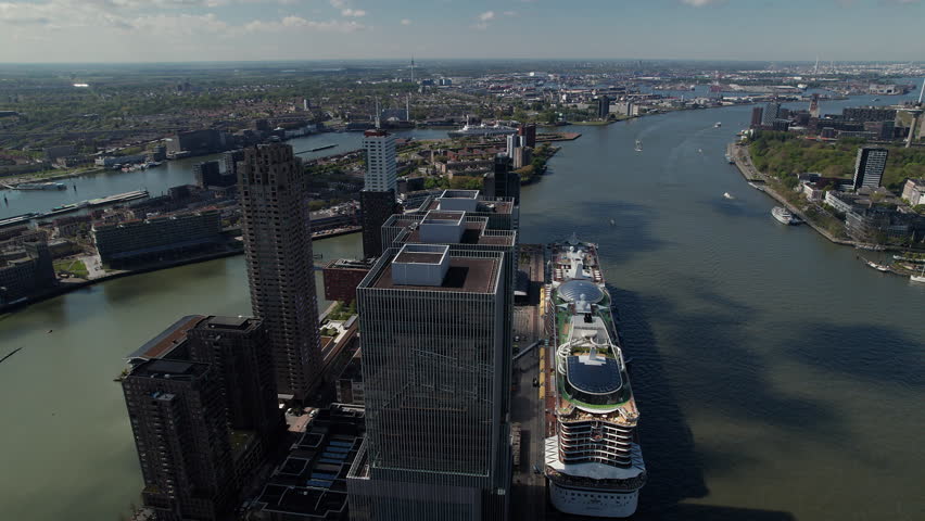 Cruise Ship Terminal On Nieuwe Maas With Office And Residential Buildings In Rotterdam, Netherlands. aerial shot