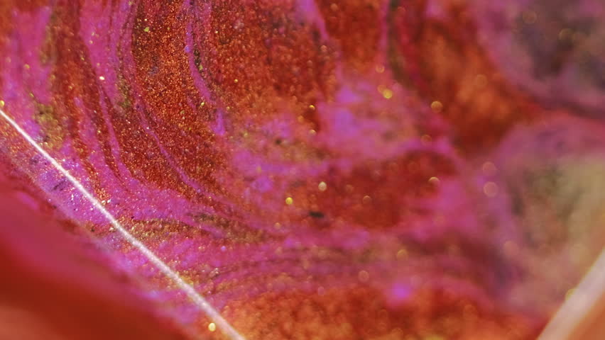 Shimmering fluid flow. Wet glitter spill. Defocused red golden orange pink color shiny texture ink fluid wave bokeh light abstract art background. - Powered by Shutterstock - Get 15% off with code: PIKWIZARD15