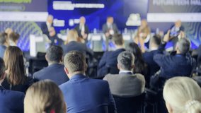 Blurred view of business professionals attentively listening to speakers at a panel discussion during a corporate conference event. - Powered by Shutterstock - Get 15% off with code: PIKWIZARD15