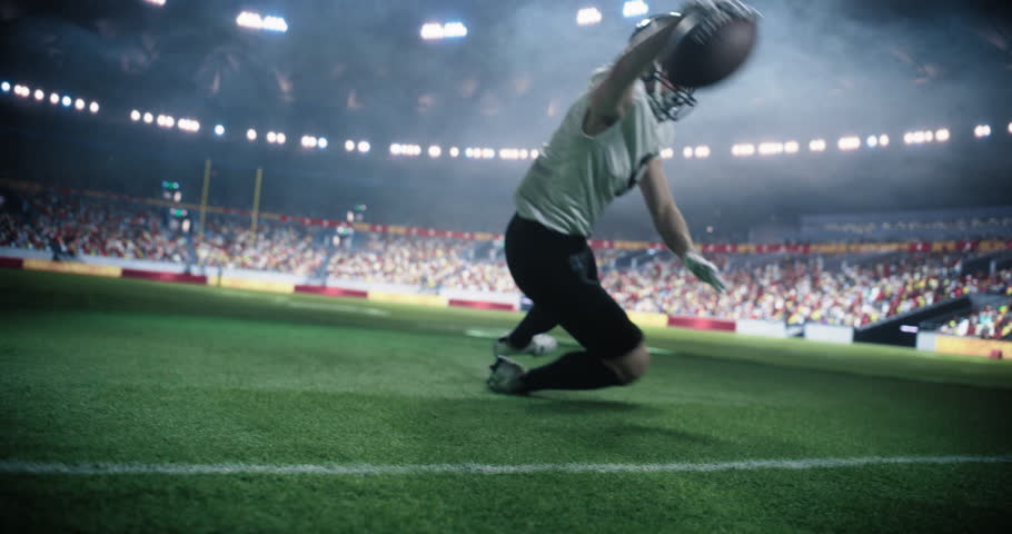 Football Player Running Towards the Endzone During a Championship Game in a Packed Stadium. The Athlete is Focused on Scoring a Touchdown as the Crowd Cheers in the Background