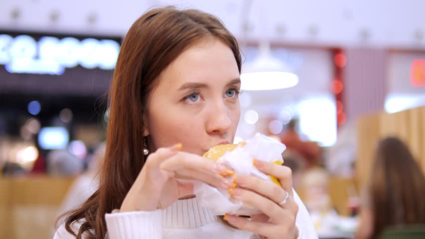 Face young woman look at camera beautiful lady portrait happy intdoor close up slow motion