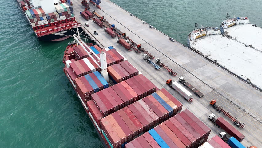Cargo Container Ship with truck at commercial dock port. Shipyard Cargo Container Sea Port Freight forwarding service logistics and transportation. International Shipping Customs Port.	
