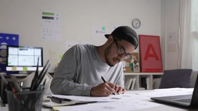 Young Asian Graphic designer working in office. Designing logo Artist Creative Designer Illustrator Graphic Skill Concept. - Powered by Shutterstock - Get 15% off with code: PIKWIZARD15