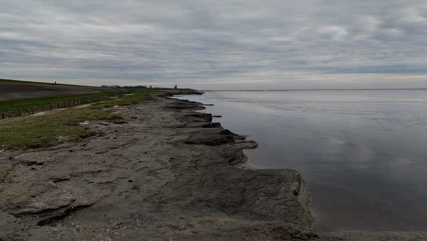 Aerial View: Picturesque Church by the Dike in Wierum Village, Friesland, Netherlands