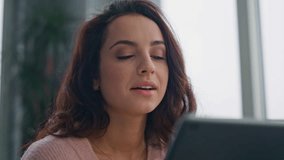 Smiling wife showing tablet screen to relaxed husband at panoramic flat closeup. Happy married couple discussing online purchase at weekend. Positive spouses looking gadgets talking in cityscape flat - Powered by Shutterstock - Get 15% off with code: PIKWIZARD15