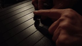 Jordanian coin spinning on a table in Amman, Jordan. The coin rotates rapidly before gradually slowing down, capturing the smooth, reflective surface of the table  - Powered by Shutterstock - Get 15% off with code: PIKWIZARD15
