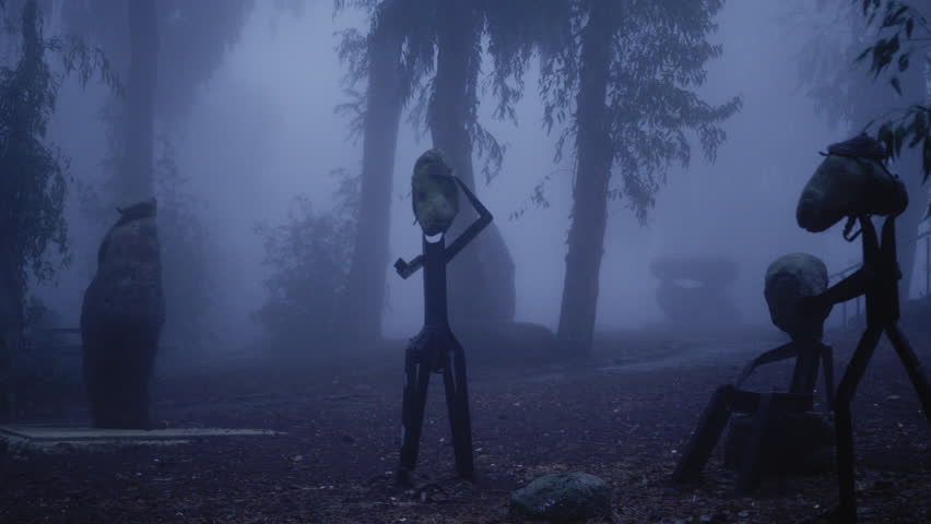 Statues in a park on a foggy day