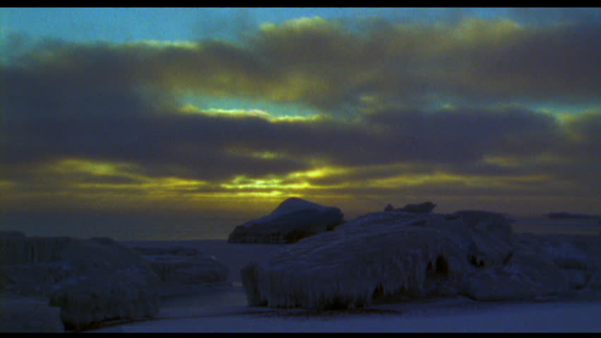 Timelapse of sunset over icy landscape