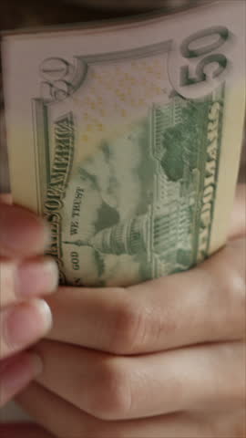 Businesswoman Counts Dollar Bills. Female Hands With Cash. Vertical.