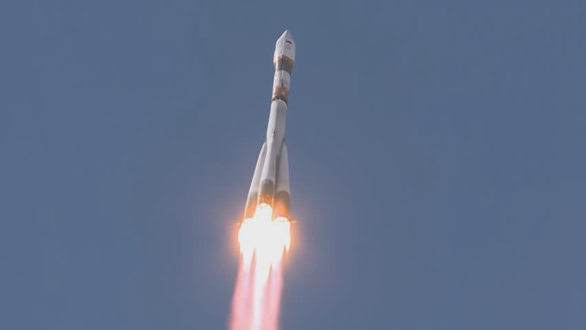 Flight in the blue sky of the Russian space rocket Soyuz-z. Baikonur Cosmodrome.