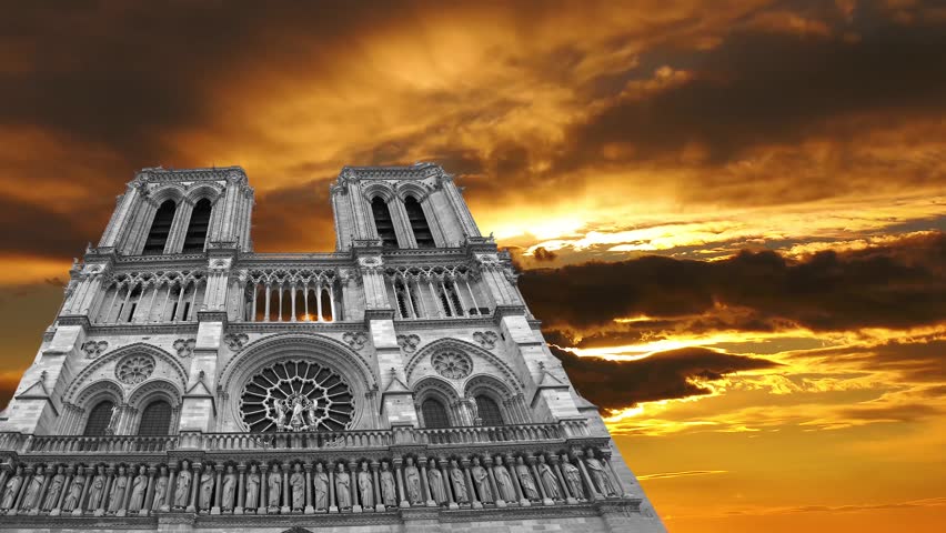 Notre Dame de Paris against the background of the sunset (4K, time lapse, with zoom), also known as Notre Dame Cathedral or simply Notre Dame, is a Gothic, Roman Catholic cathedral of Paris, France