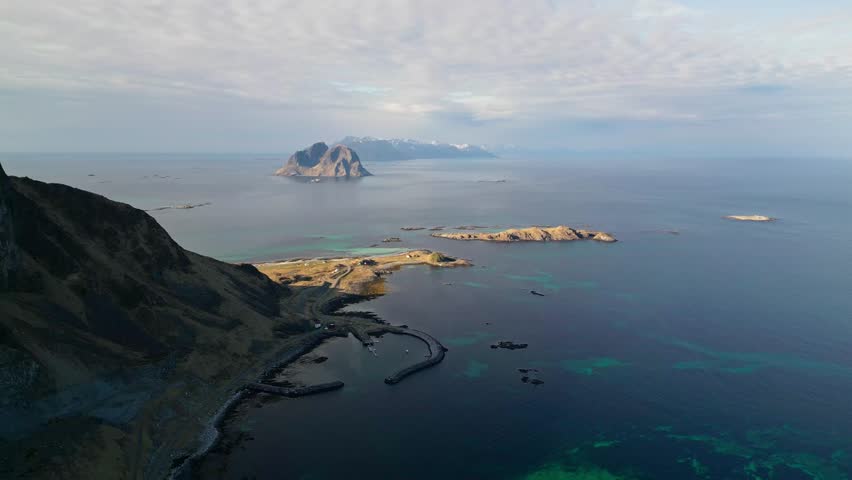 Epic view of hills sea and distance island of Vaeroy, Norway
