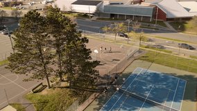 Top down view of a group of street basketball players playing hard on the court Canada, Dartmouth. Sport, leisure games and male friendship concept - group of men or friends playing street basketball  - Powered by Shutterstock - Get 15% off with code: PIKWIZARD15