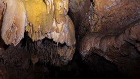  Beautiful view of stalactites and stalagmites in an underground cavern . High quality 4k footage