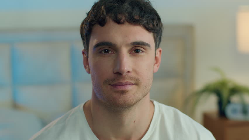 Close up happy Caucasian young man looking at camera toothy dental smile joy fun home bedroom male guy enjoy face expression facial emotion portrait smiling laugh positive relaxation cheerful gesture