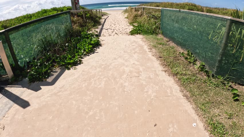 A sandy path leading to the beach
