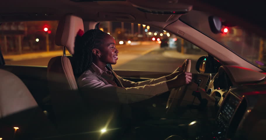 Night, black woman driving car in city and smile for business commute, transport or travel. Automobile, drive and journey with happy employee in vehicle for evening trip in dark on urban town street