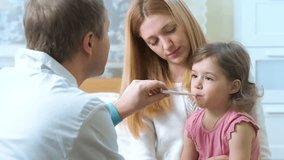 Doctor is measure the temperature of little girl. - Powered by Shutterstock - Get 15% off with code: PIKWIZARD15