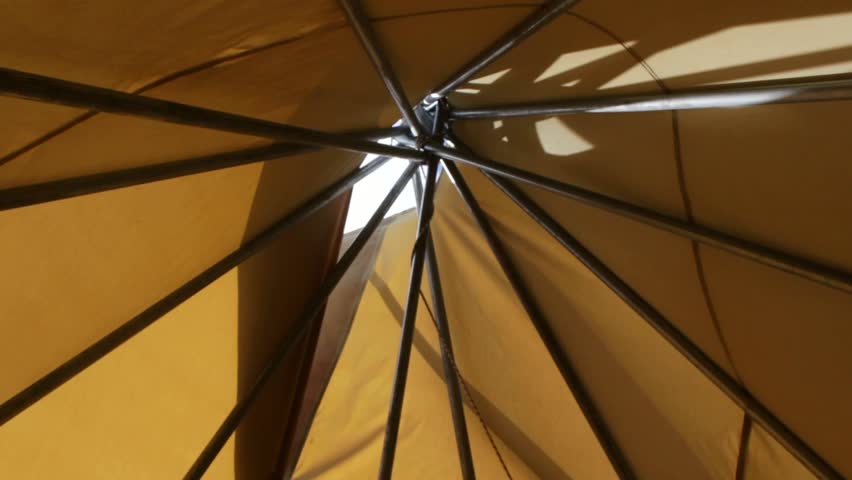 large white wigwam in a coniferous forest, a traditional Indian dwelling