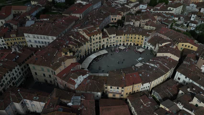 Lucca Italy busy downtown city centre pullback flight