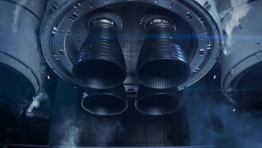 Large Rocket Engine Ignition. Powerful and Hot Flames Burst out of the Nozzle after Initial Impulse. Rocket Launch at Night. Vertical Takeoff of Large Space Exploration Rocket with Boosters. 