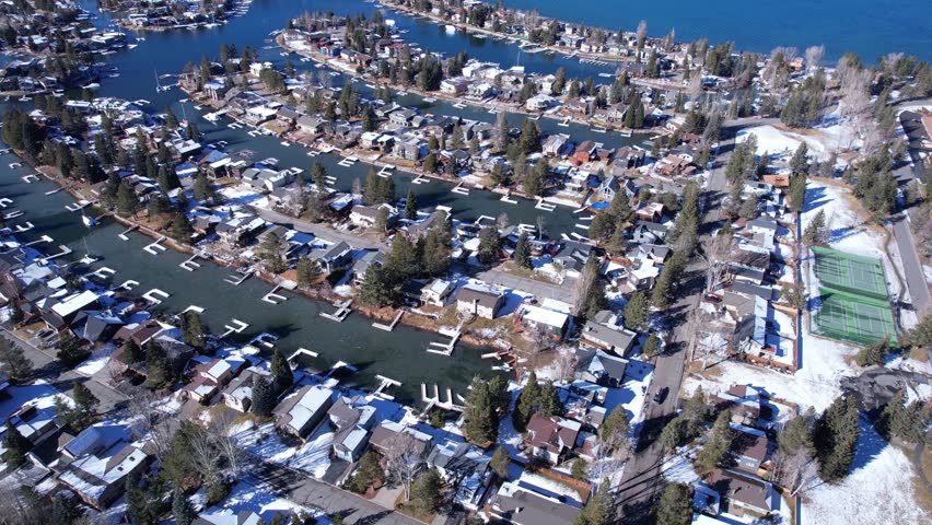 Aerial View of Tahoe Keys Neighborhood by Lake Tahoe, California USA on Sunny Winter Day, Houses and Canals, Drone Shot