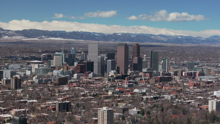 City Wash Park Downtown Denver Colorado aerial drone neighborhood streets Spring Mount Blue Sky Evans Front Range Rocky Mountains foothills skyscrapers daytime sunny clouds slow zoom in