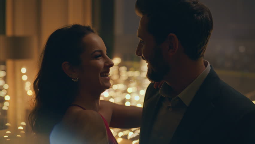 Enamoured lovers dancing romantic evening at home together closeup. Happy boyfriend bonding to girlfriend in dance at candles light apartment. Affectionate married couple enjoying love relationship