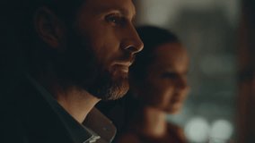 Evening couple drinking champagne celebrating anniversary at dark window closeup. Brunette romantic woman looking beloved husband toasting glasses at night panoramic apartment. Affectionate pair date - Powered by Shutterstock - Get 15% off with code: PIKWIZARD15