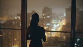 Evening woman laughing mobile phone at panoramic window room back view. Young relaxed lady receiving cellphone notification at luxury flat. Gorgeous model waiting boyfriend looking night cityscape  - Powered by Shutterstock - Get 15% off with code: PIKWIZARD15