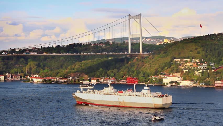 Istanbul FSM Bridge with a large vehicles carrier passing under. Fatih Sultan