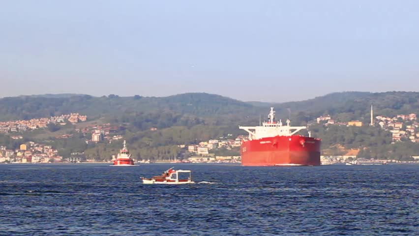 Large tanker ship sails into. Bow of the large red ship
