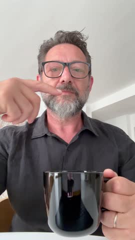 Phone laptop camera view of man doing videocall talking during morning breakfast in hotel room or home. Modern people and technology. Video calling business concept lifestyle businessman on travel.