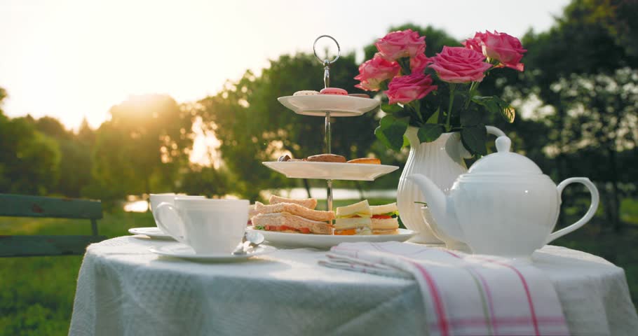 Traditional English afternoon tea on warm summer afternoon.