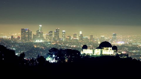 Noctural Time Lapse of Griffith Observatory in Foreground with Downtown LA in the Background