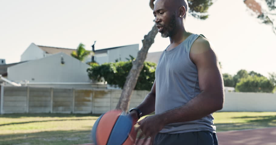 Friends, basketball court and men with practice in park for sport, coaching and help in training. Summer, black people and energy with challenge in nature for fitness, exercise and workout in Chicago