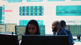 Company employees employing big data used in solving tasks, studying infographics on a huge display. Business analysts reviewing current situation numbers for annual reports. Camera A. - Powered by Shutterstock - Get 15% off with code: PIKWIZARD15