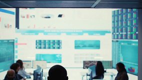 Administrative assistant examining important big data visualizations on a huge display, creating an analysis to review key performance indicators and business efficiency. Camera B. - Powered by Shutterstock - Get 15% off with code: PIKWIZARD15