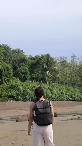 Young Latin woman walking on a beach in Costa Rica.