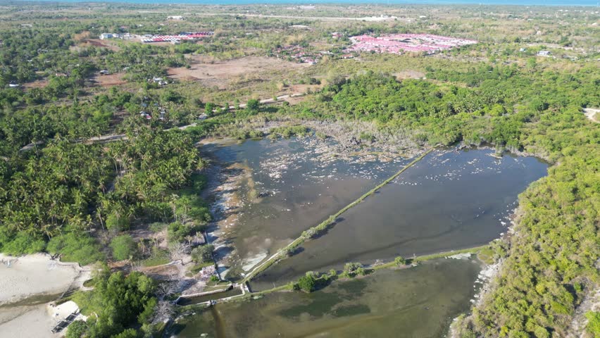 Aerial view of a Paradise Beach (Sandira Beach), in The Philippines, Bantayan Island. White-sand beach and crystal-clear waters. Paradise.