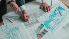 Architecture design project Arabian man architect designer engineer muslim women in hijab talk discuss office interior drawing building floor plan drafting blueprint on paper business team colleagues - Powered by Shutterstock - Get 15% off with code: PIKWIZARD15