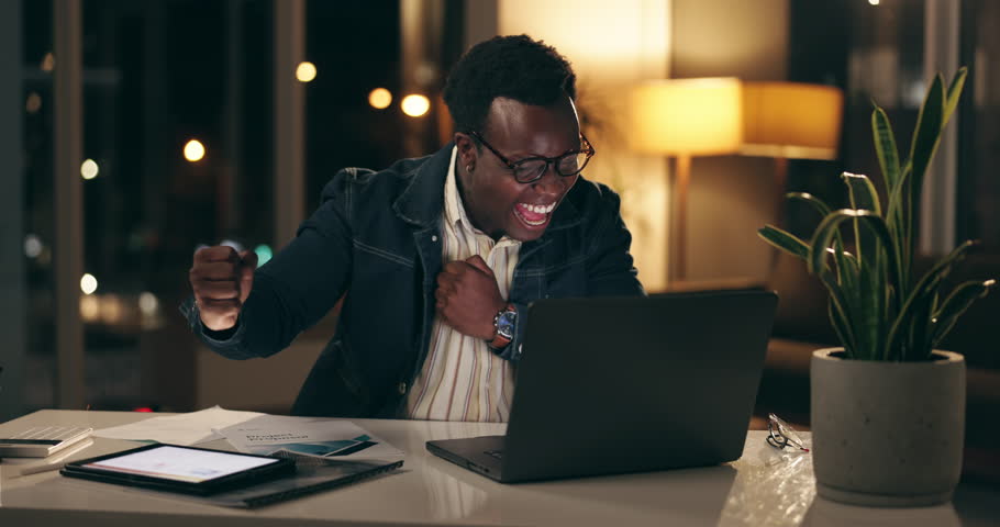 Excited, businessman and hands in air with laptop for stock market, growth and financial success. Black man, trading and celebration in office with technology for investment, winning and achievement