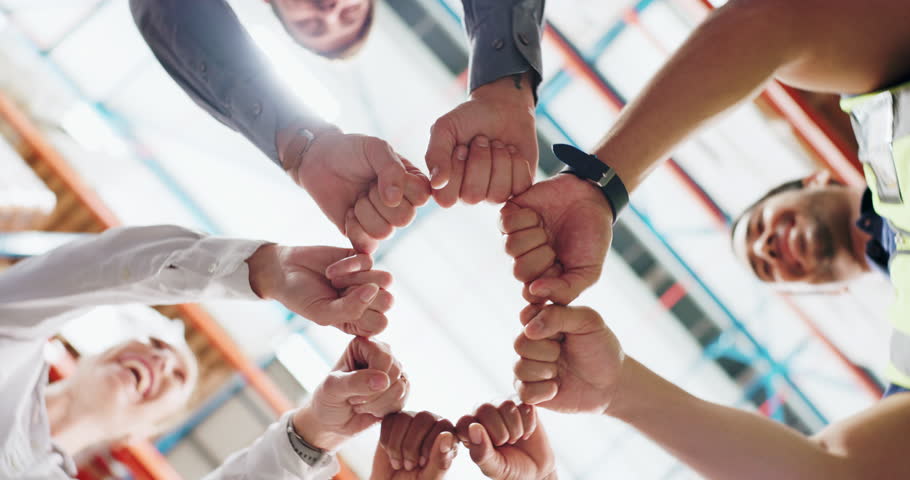 Warehouse, hands and fist bump for success, teamwork and victory of stock management. Collaboration, solidarity and celebration of factory staff with support, partnership and achievement of employees